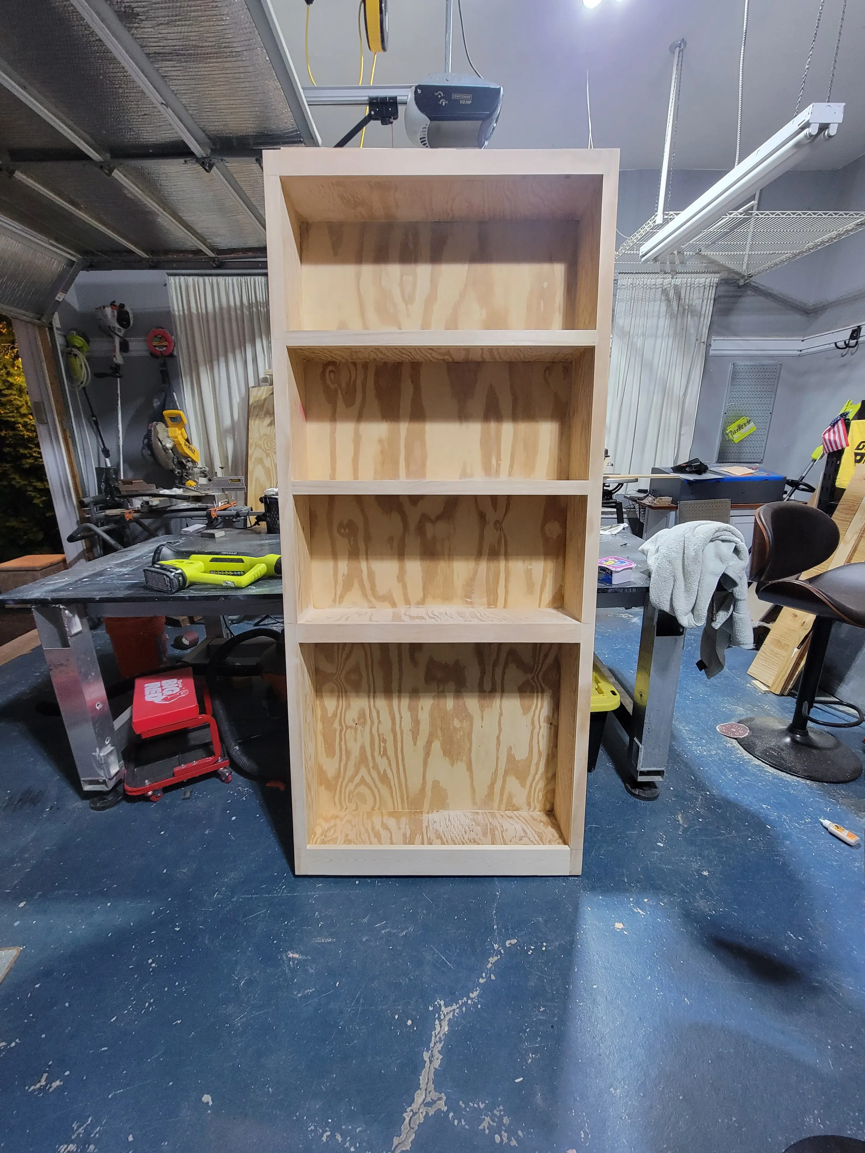 Wooden bookcase unfinished wood in a garage