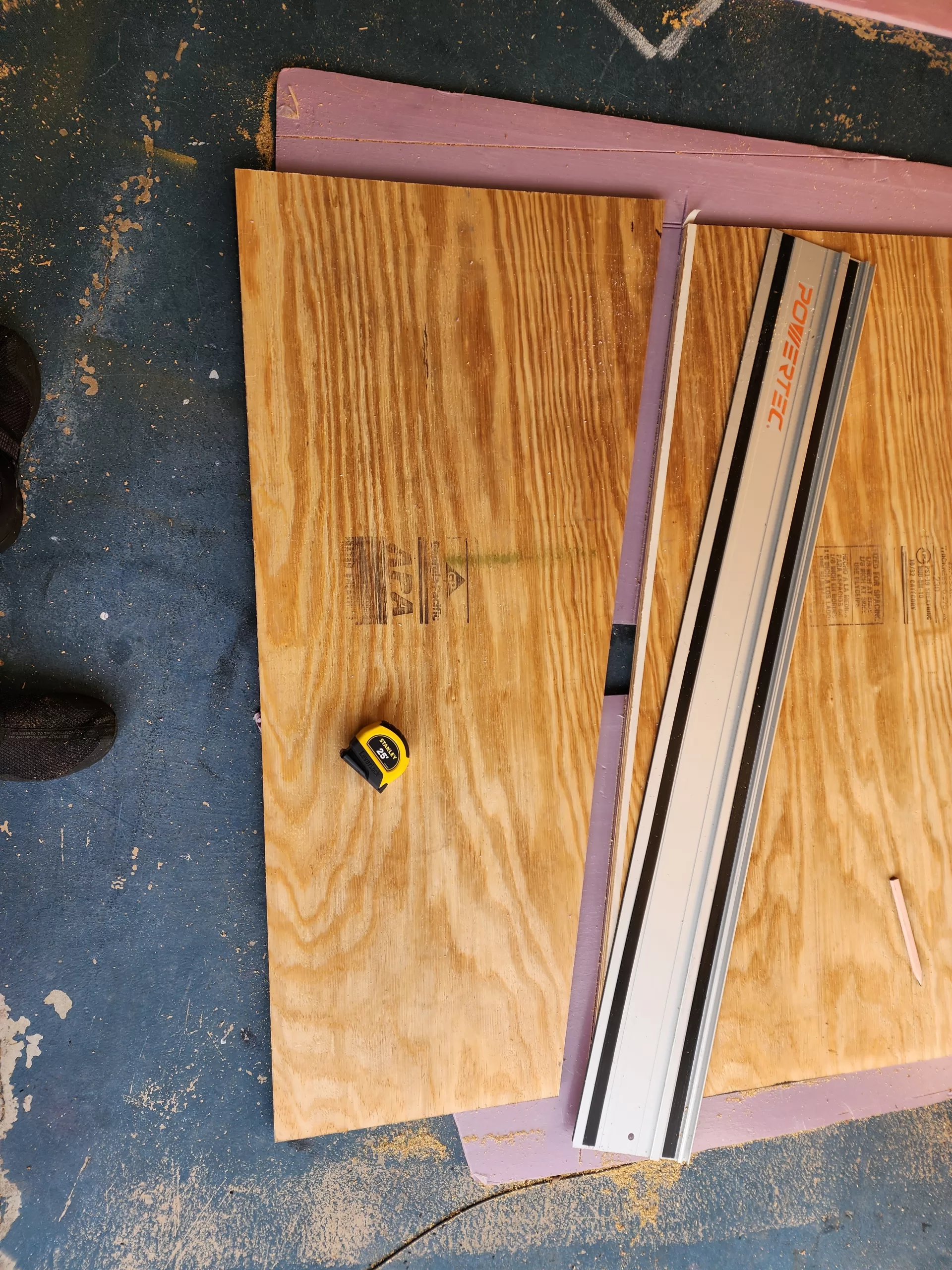 22/32 plywood in store, rough cut lumber on floor