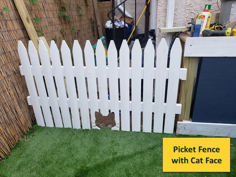 White Picket Fence with Cat Face